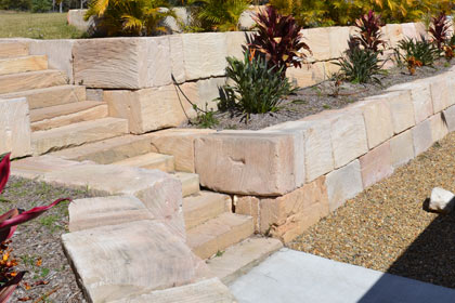 Sculptured garden with  retaining wall made from sized sandstone