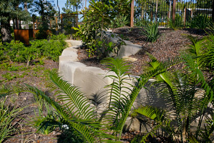 Sculptured garden with  retaining wall made from sized sandstone