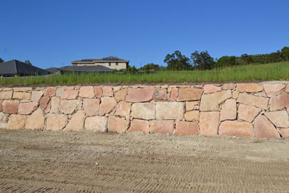 Sculptured garden with  retaining wall made from sized sandstone